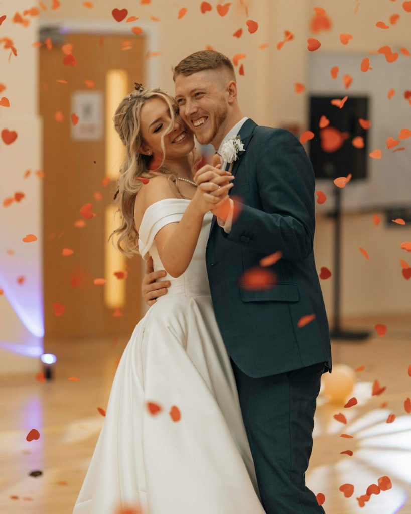 bride and groom first dance with confetti