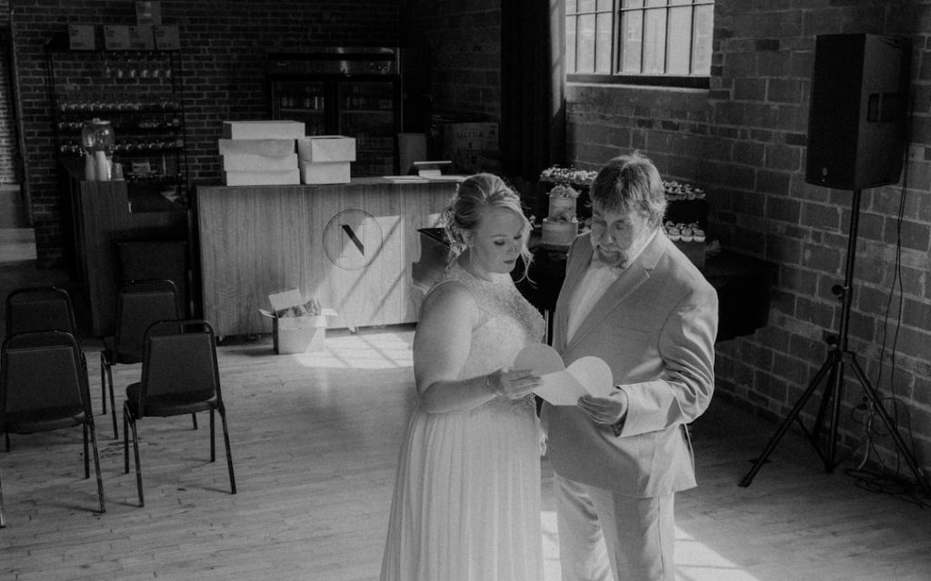 Mallory and Her dad reading at the gift she made for him