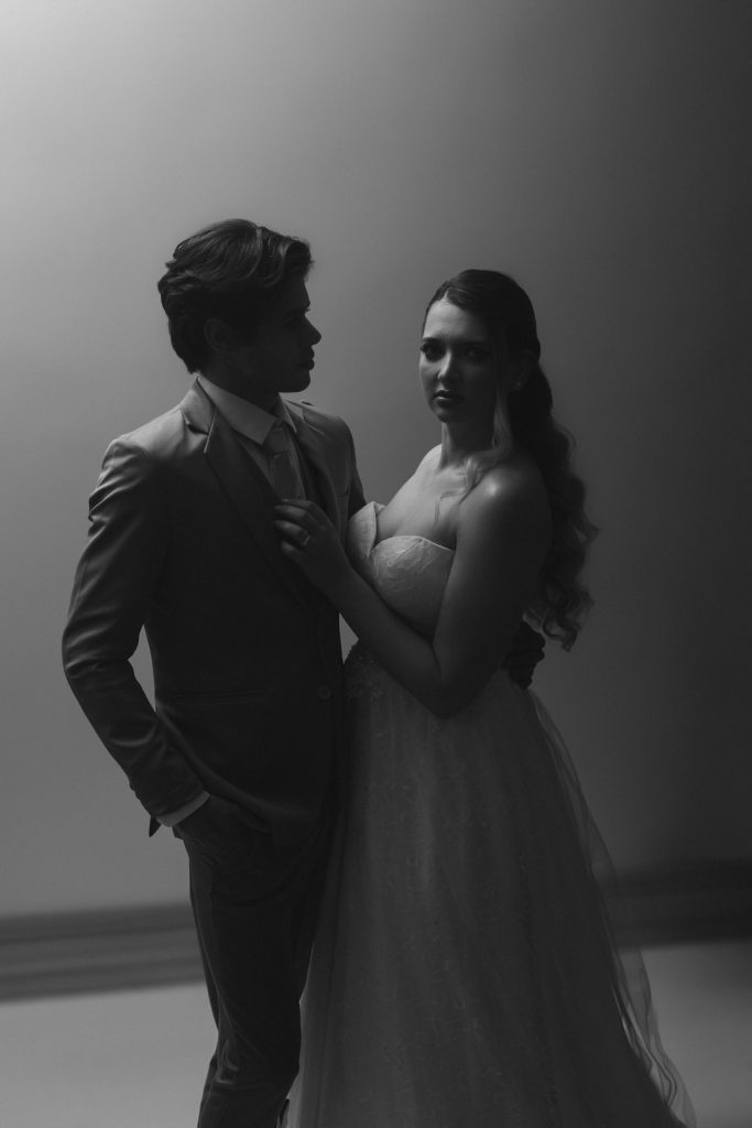 a-man-and-a-woman-standing-next-to-each-other-zjpxicemnpy
